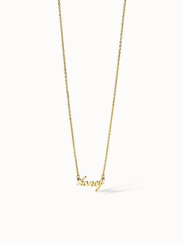 Honey Kette von PURELEI, vergoldet, geschwungener Schriftzug "honey", eleganter Schmuck mit warmem, femininem Design