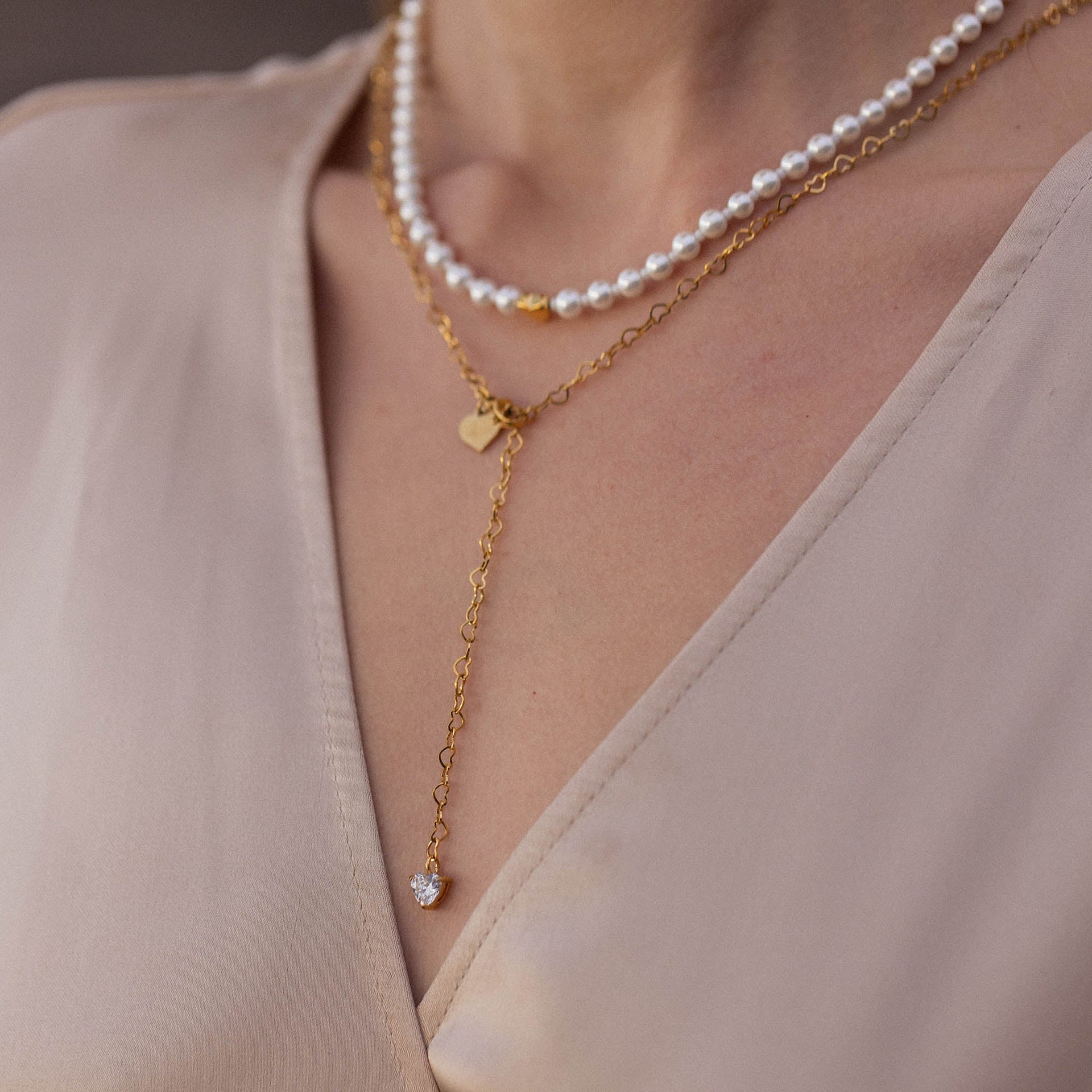 Zarte PURELEI Kette aus Roségold mit Muscheln und Herzanhänger, elegant und feminin.