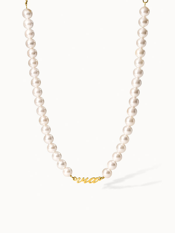 Perlenkette mit goldenem Schriftzug 'Aloha' von PURELEI, elegant und feminin.