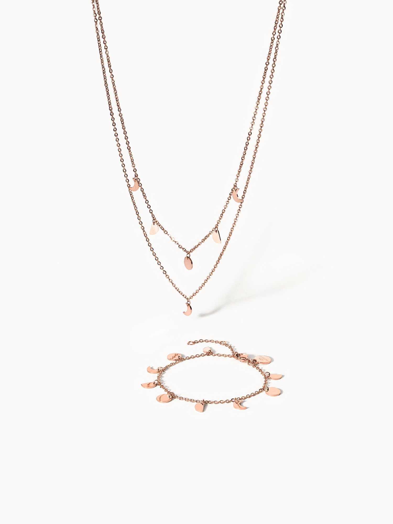Roségoldene Kette und Armband mit tropischem Design von PURELEI, elegant und feminin.