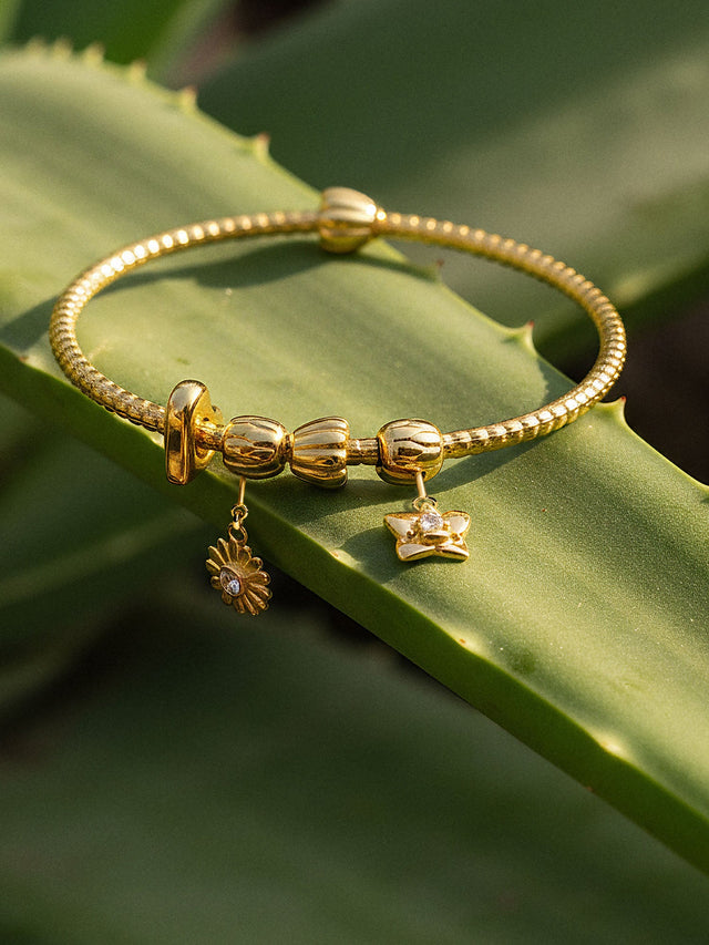 Lei Charm bangle with two stopper charms