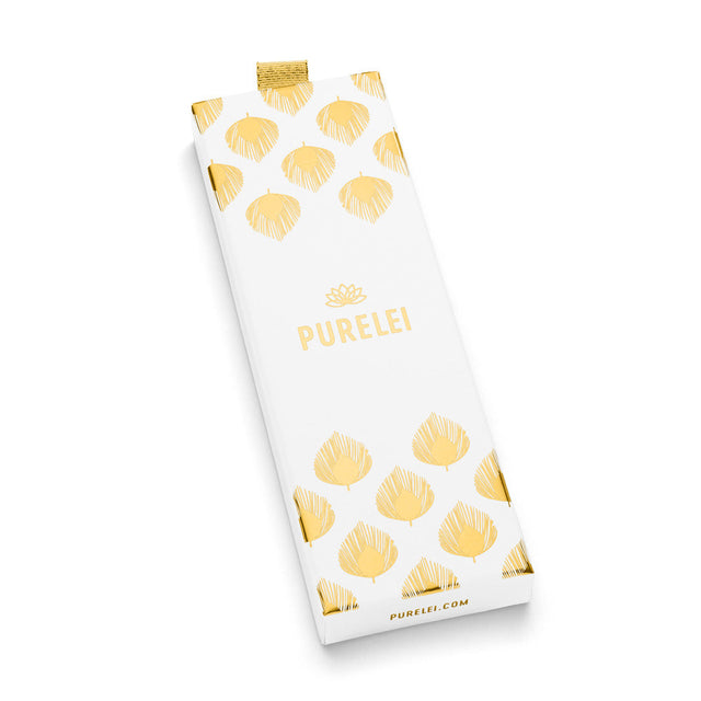 Mahina Club Kahakai Verpackung in Weiß mit goldenen Muschelmotiven, elegant und pur, PURELEI Brand.